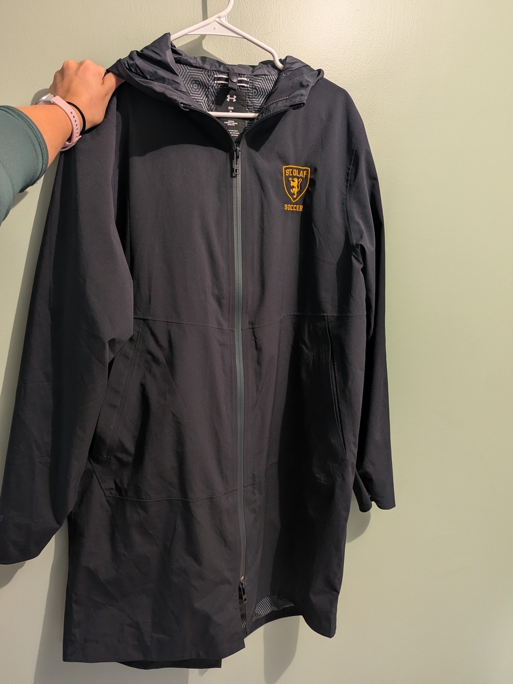 Under Armour Women’s Black St. Olaf Soccer Lightweight Hooded Rain Coat